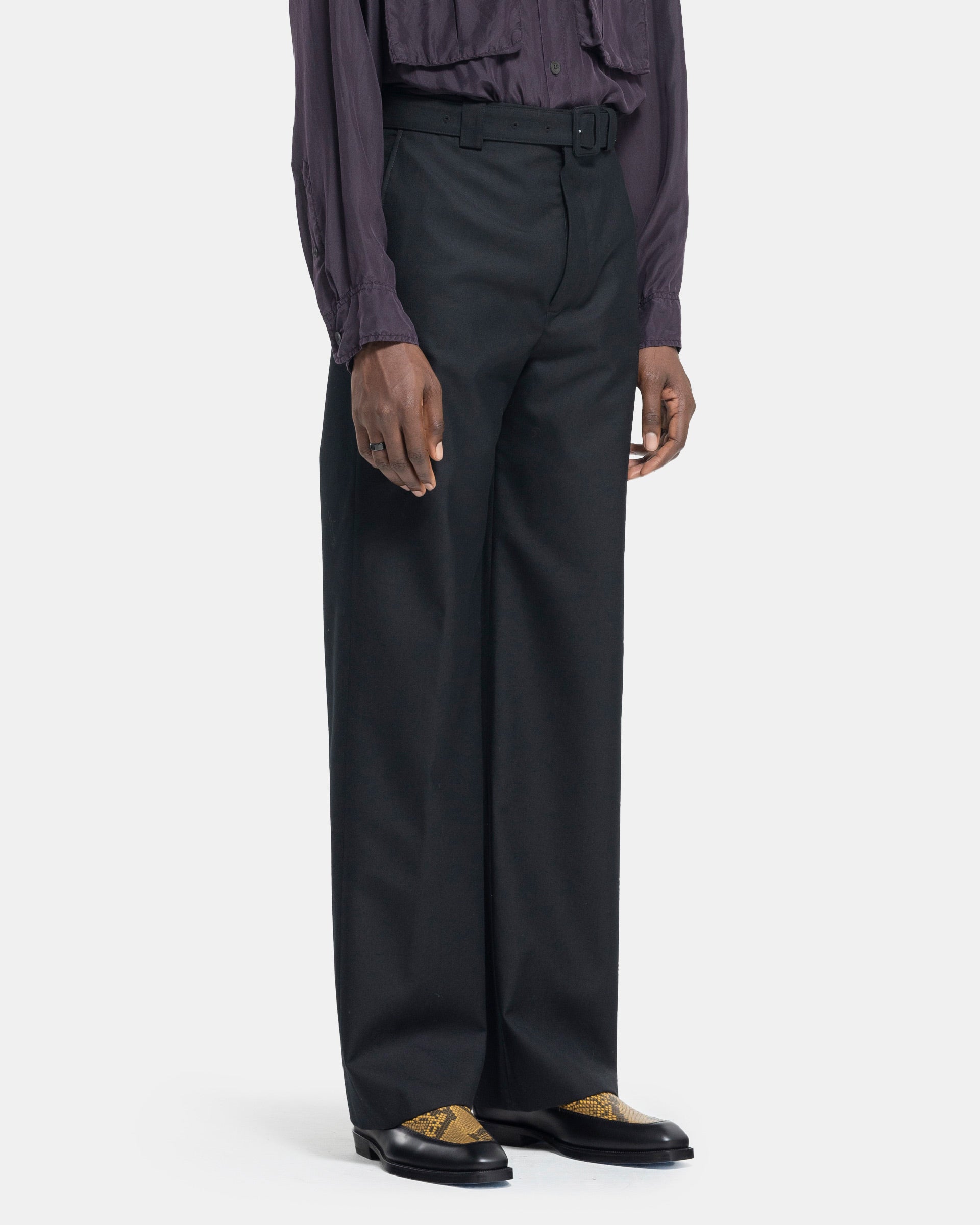 Model wearing Dries Van Noten Paulson Pants in Black on a white background