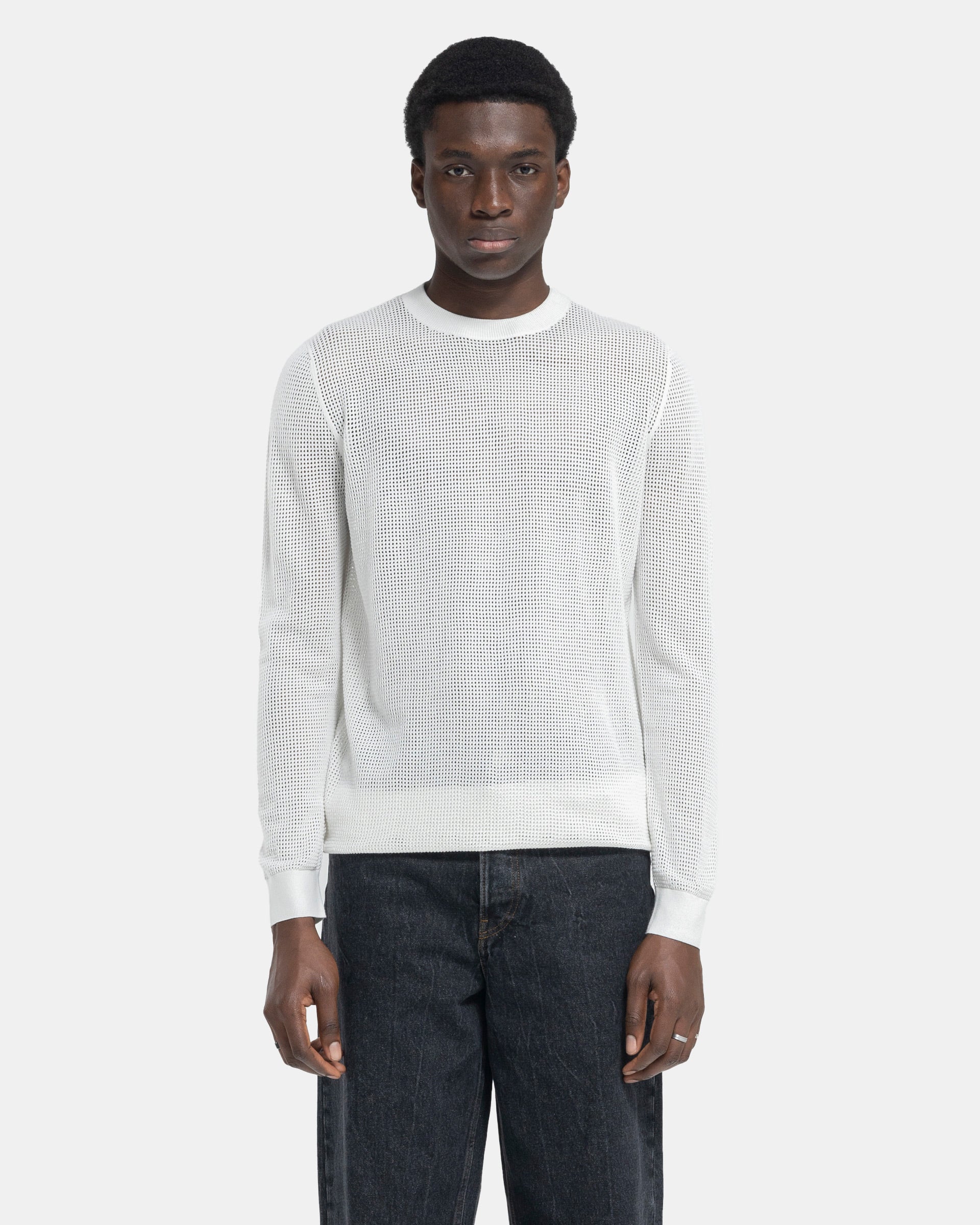 Model wearing Dries Van Noten Mixed Sweater in White on a white background