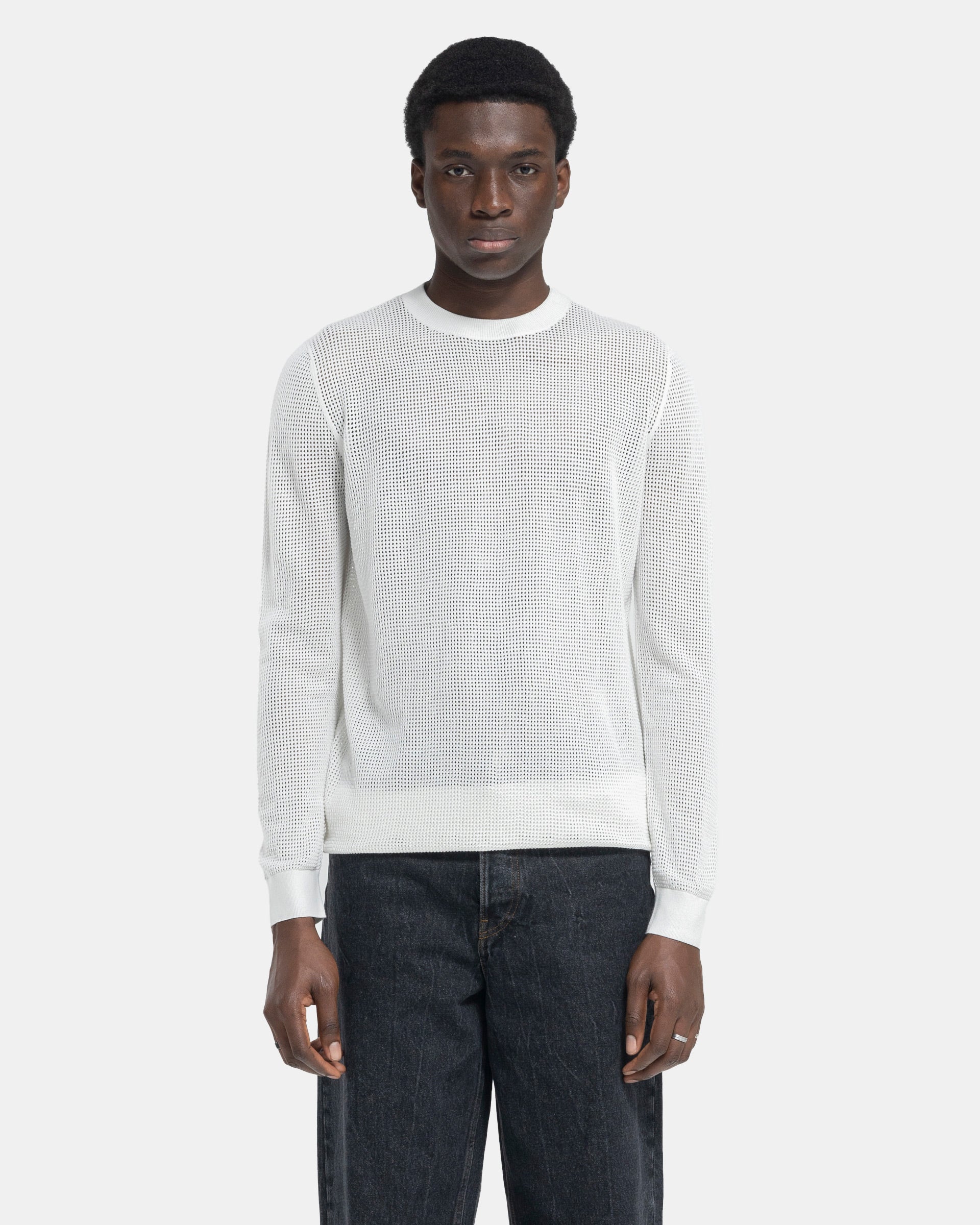 Model wearing Dries Van Noten Mixed Sweater in White on a white background