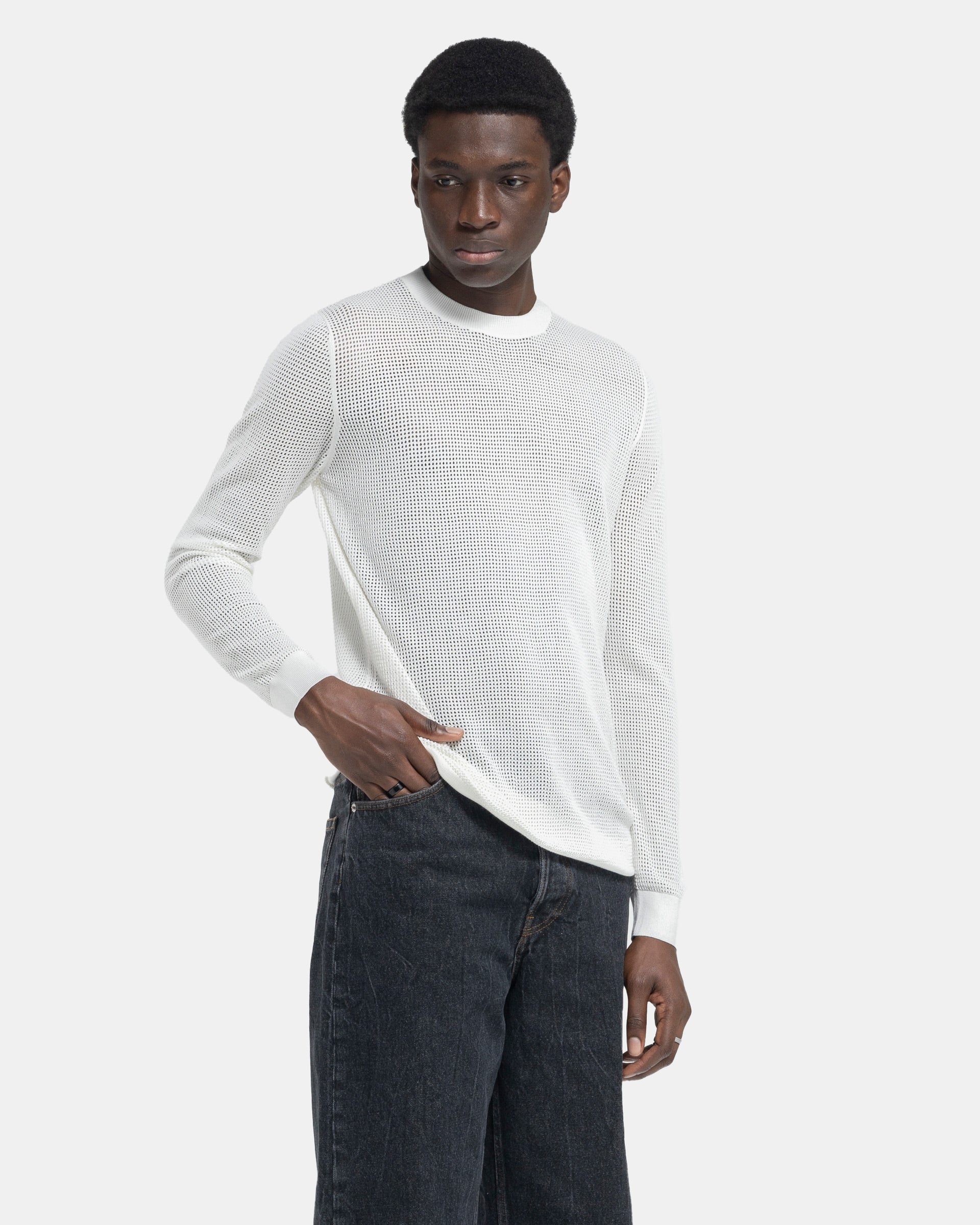 Model wearing Dries Van Noten Mixed Sweater in White on a white background
