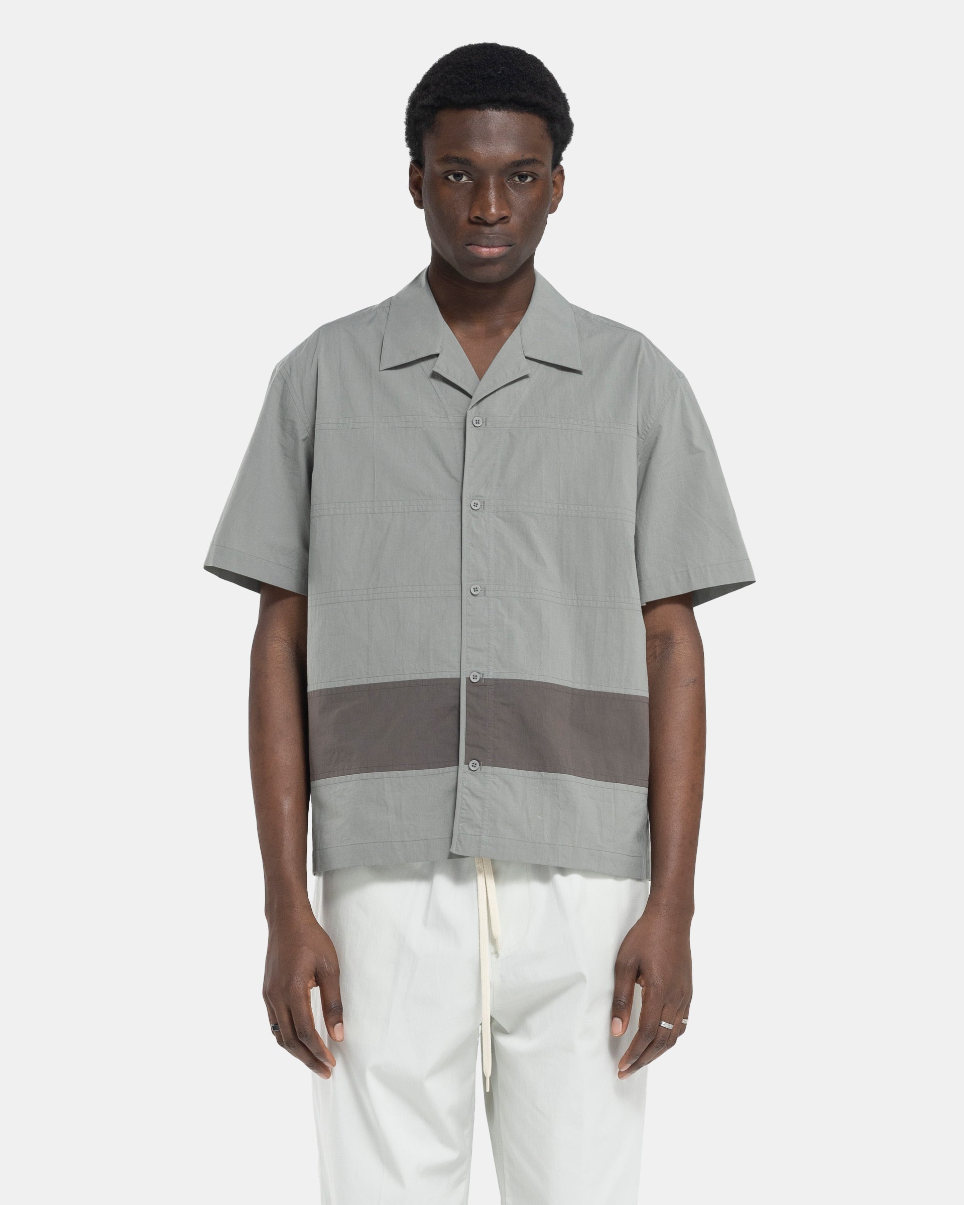 Model wearing Craig Green Barrel Shirt in Grey on white background