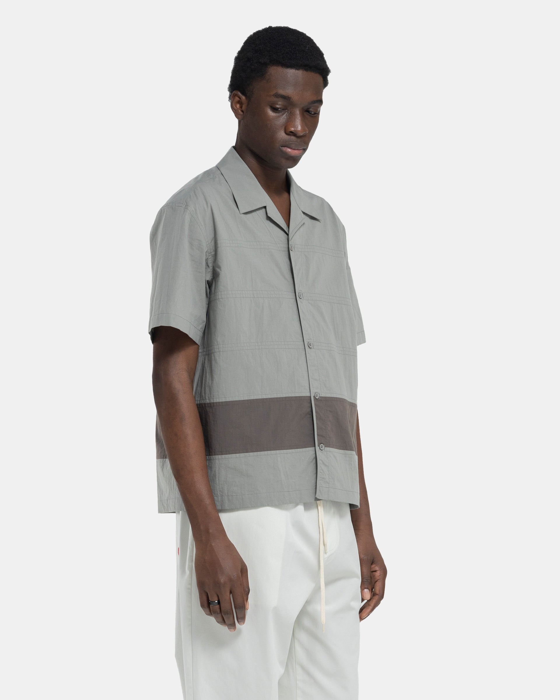 Model wearing Craig Green Barrel Shirt in Grey on white background