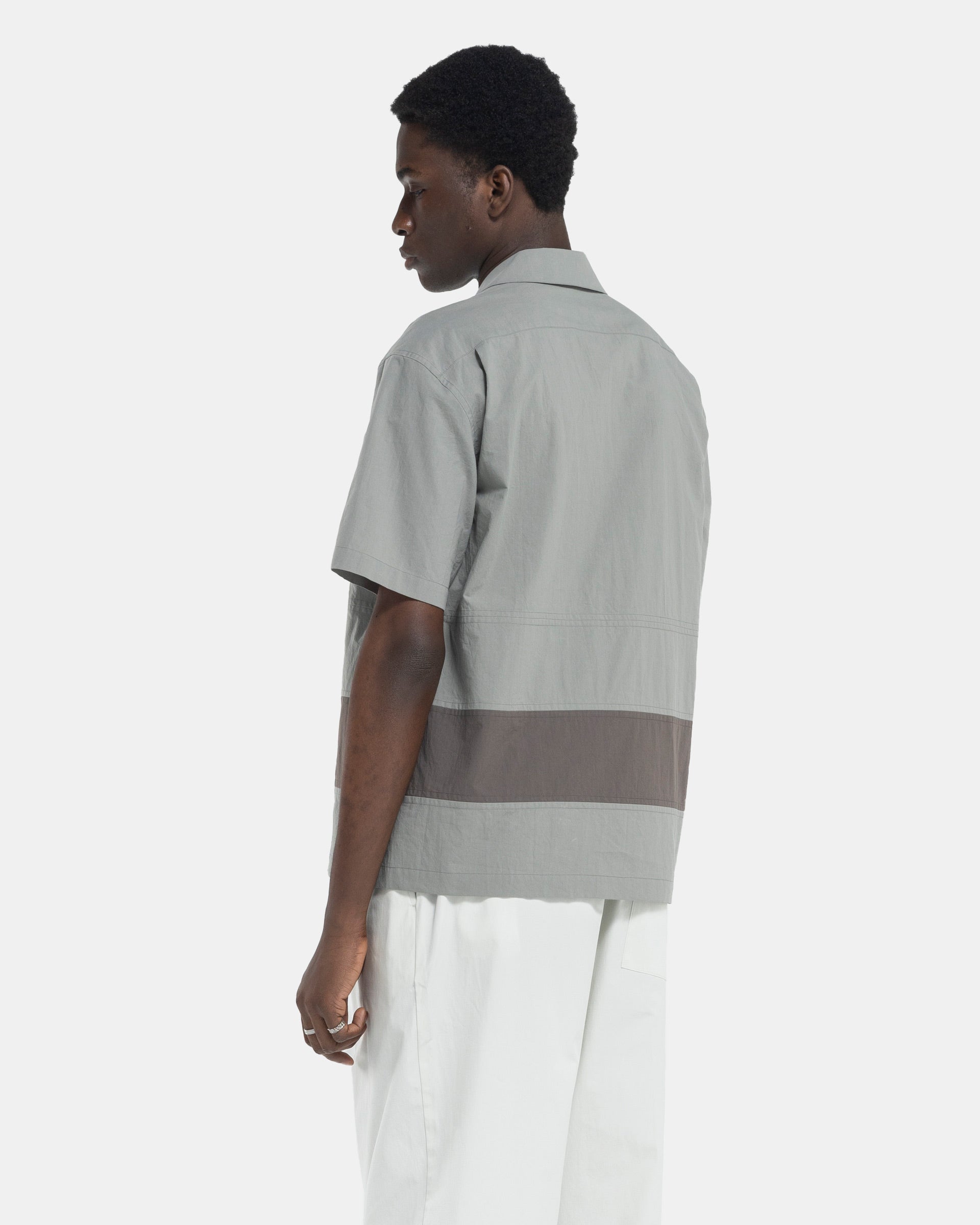 Model wearing Craig Green Barrel Shirt in Grey on white background