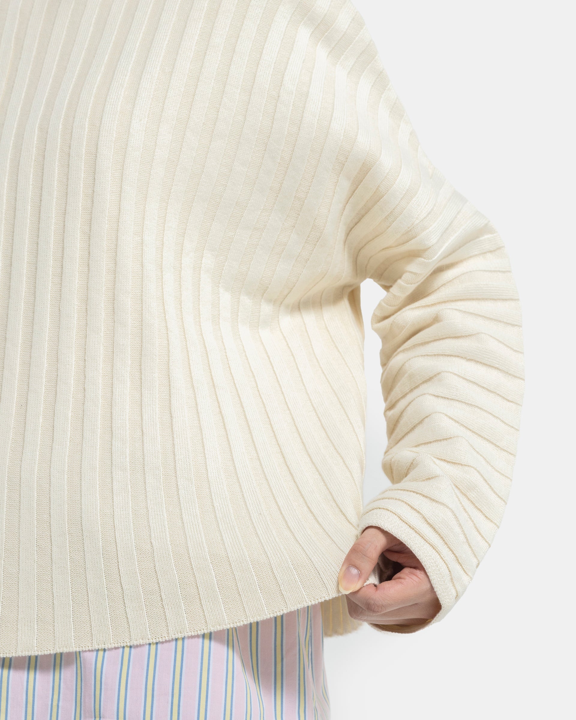 Pulling Eckhaus Latta Designer Wool Off-White Sweater with knit stripes