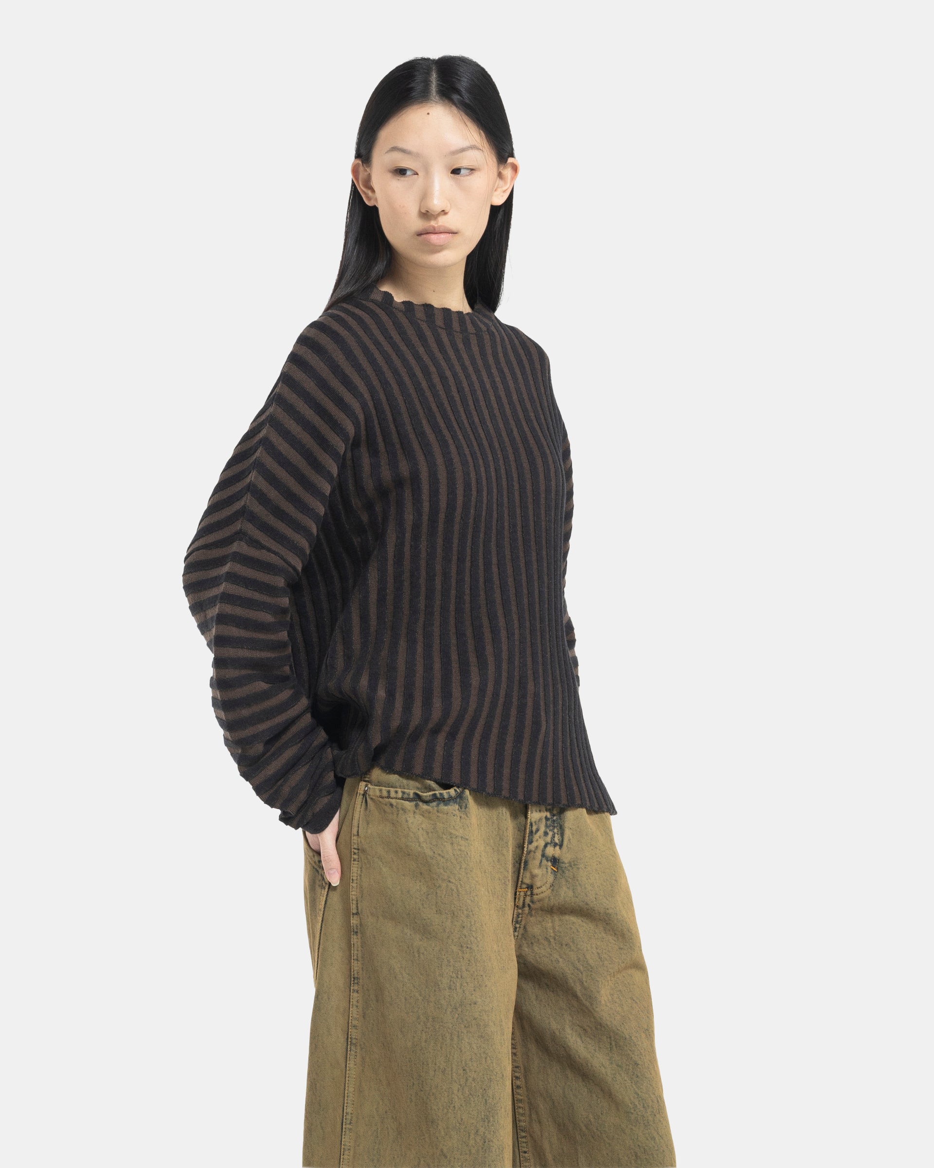 Female model wearing Eckhaus Latta Designer Wool Brown Sweater with knit stripes