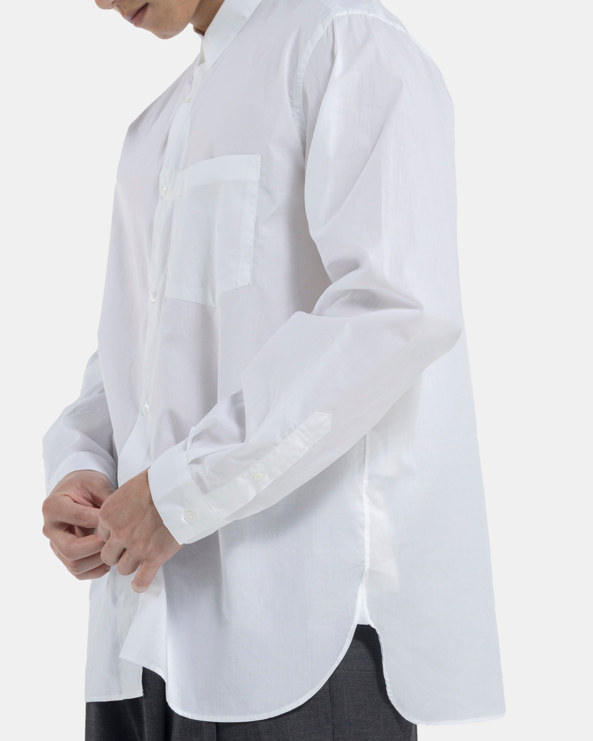 Male model wearing white Still By Hand shirt on white background