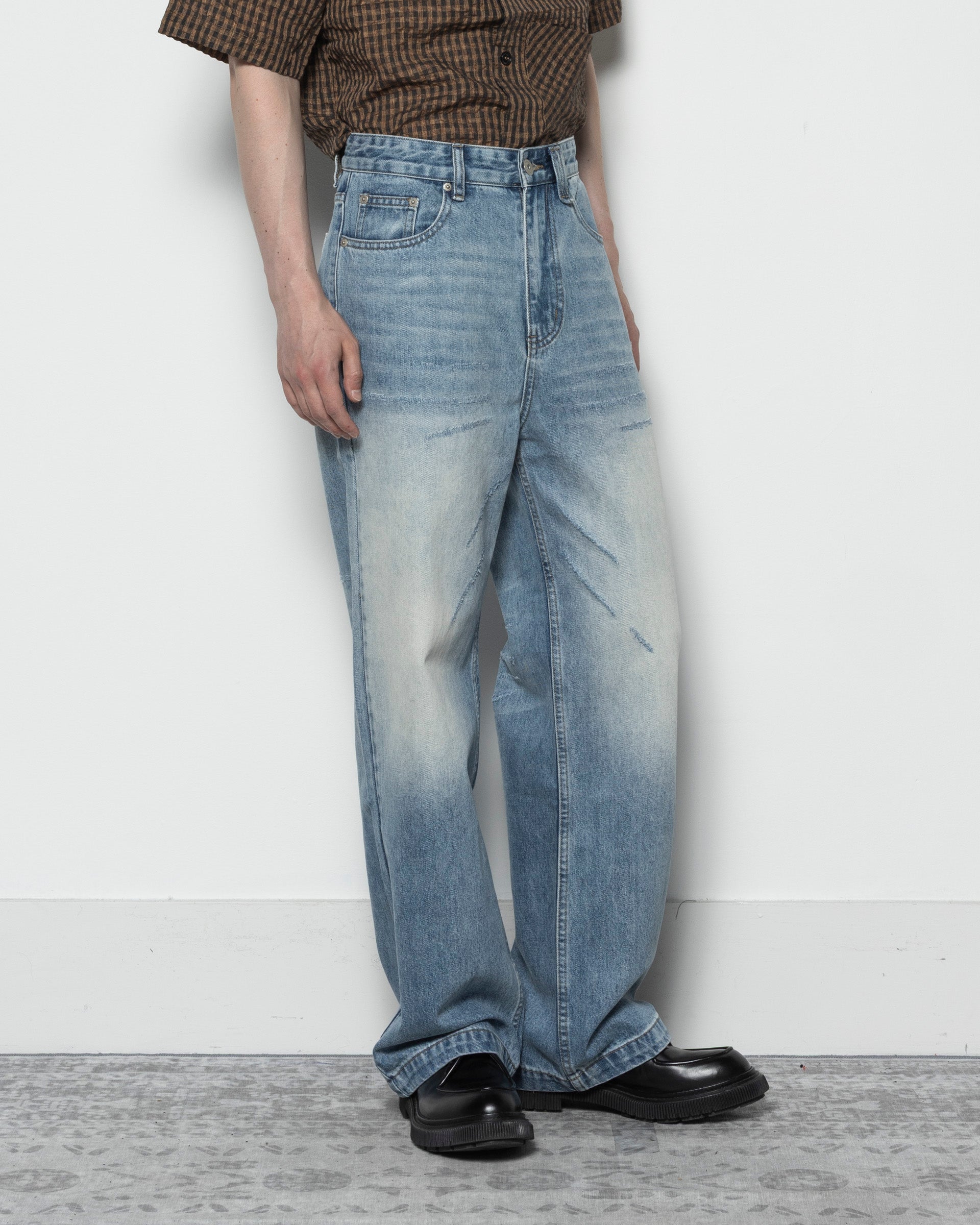 Scar Cut Whisker Jeans in Blue