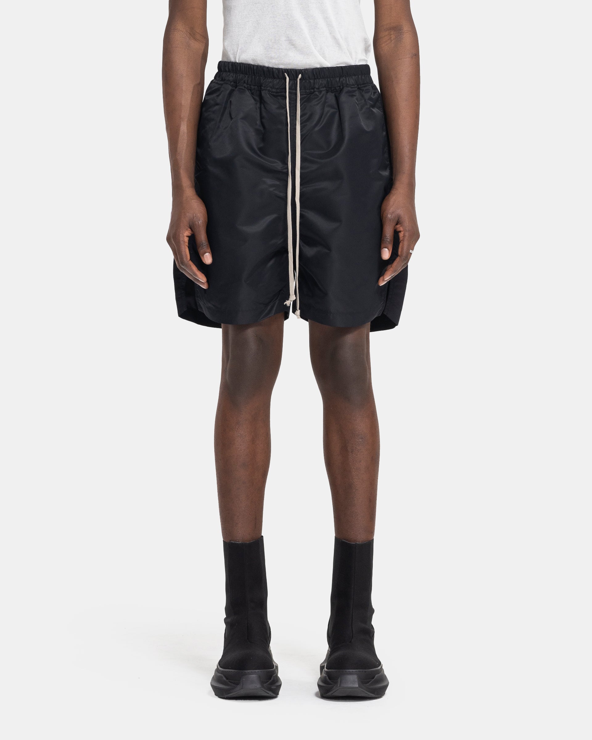 Model in Rick Owens DRKSHDW Long Boxer Shorts in Black on a white background. 