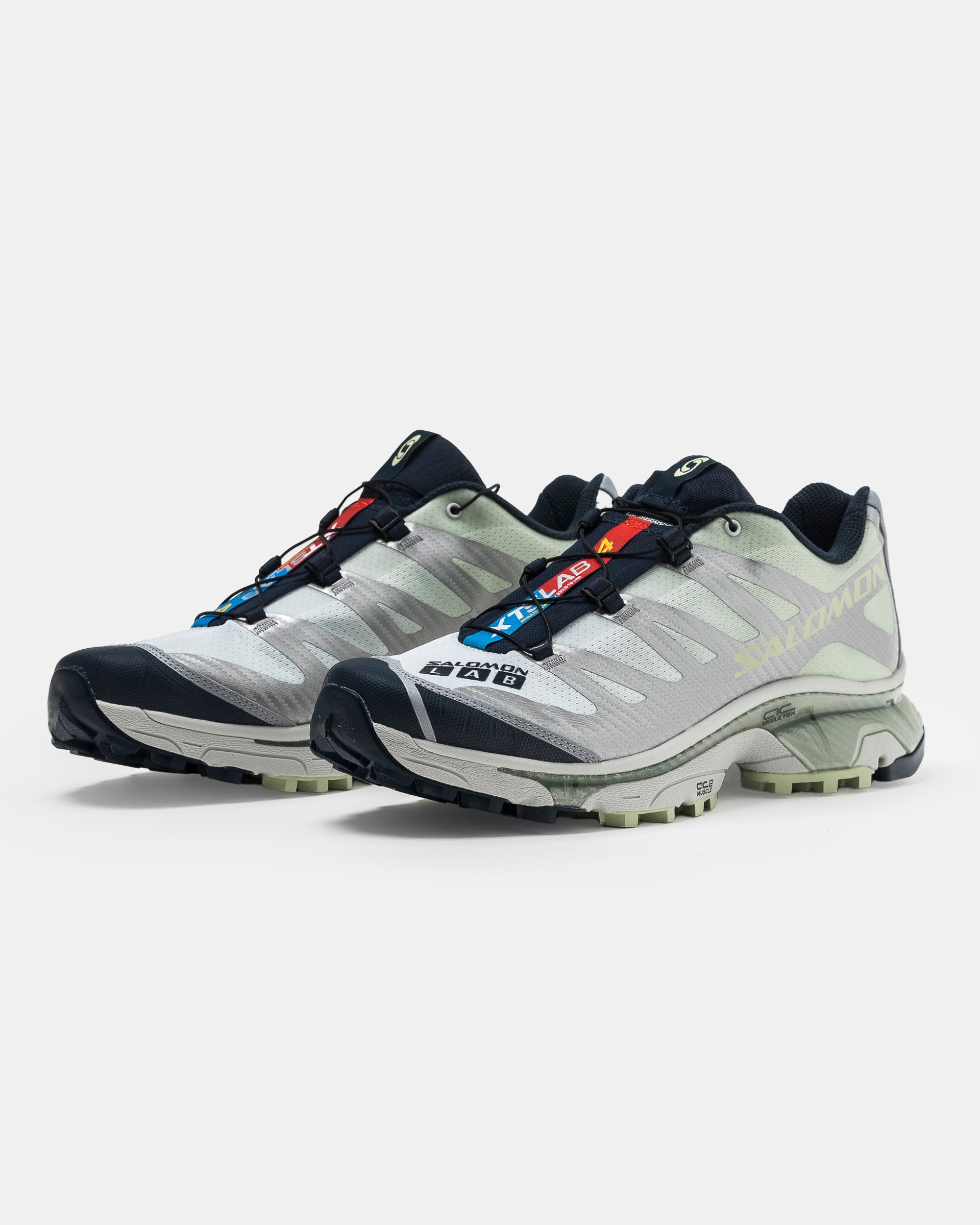 Salomon XT-4 OG in Carbon, Celadon Green, and Silver on the white background.