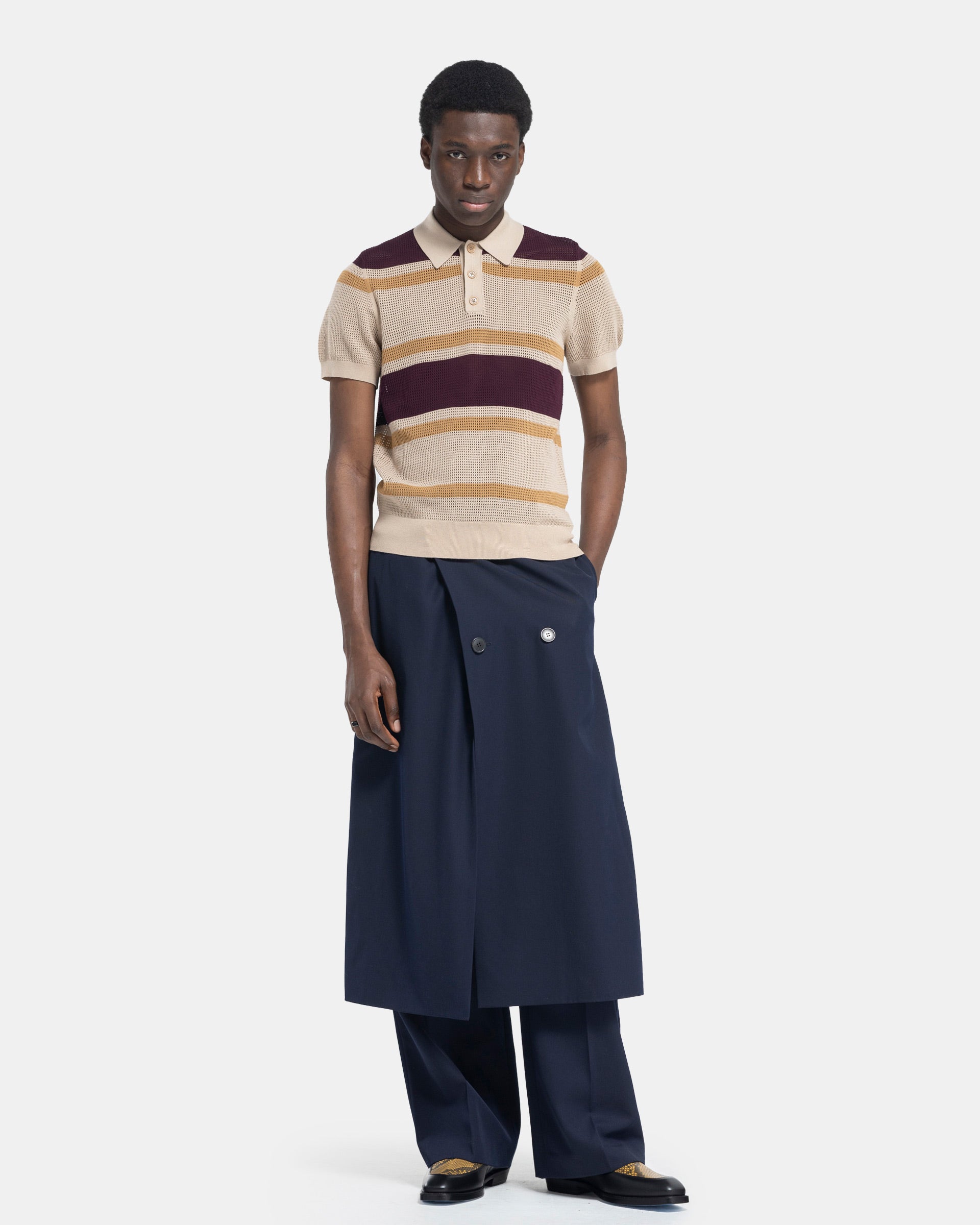 Model wearing Dries Van Noten Priffith Pants in Navy on white background