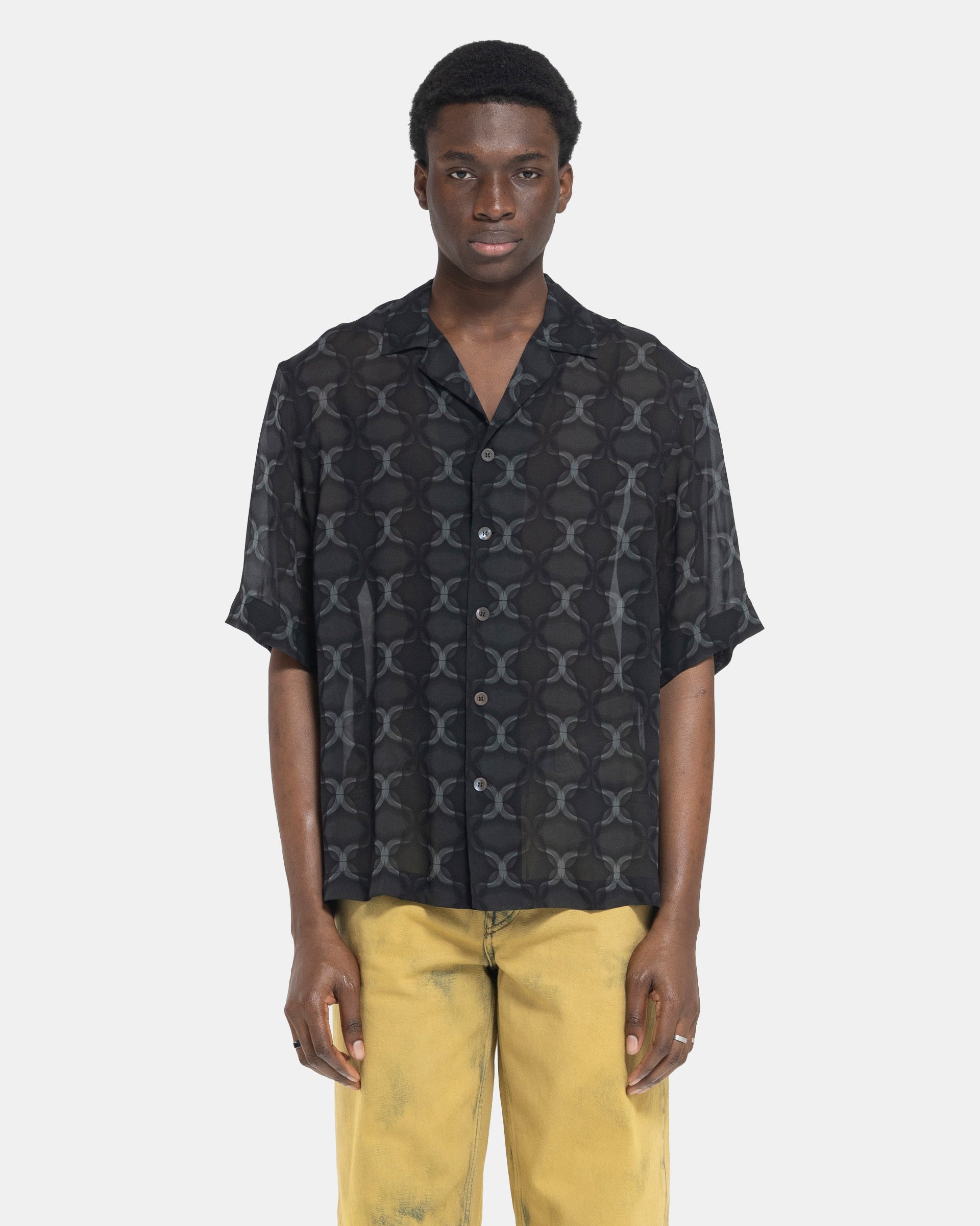 Model wearing Dries Van Noten Cassi Shirt in Anthracite on the white background