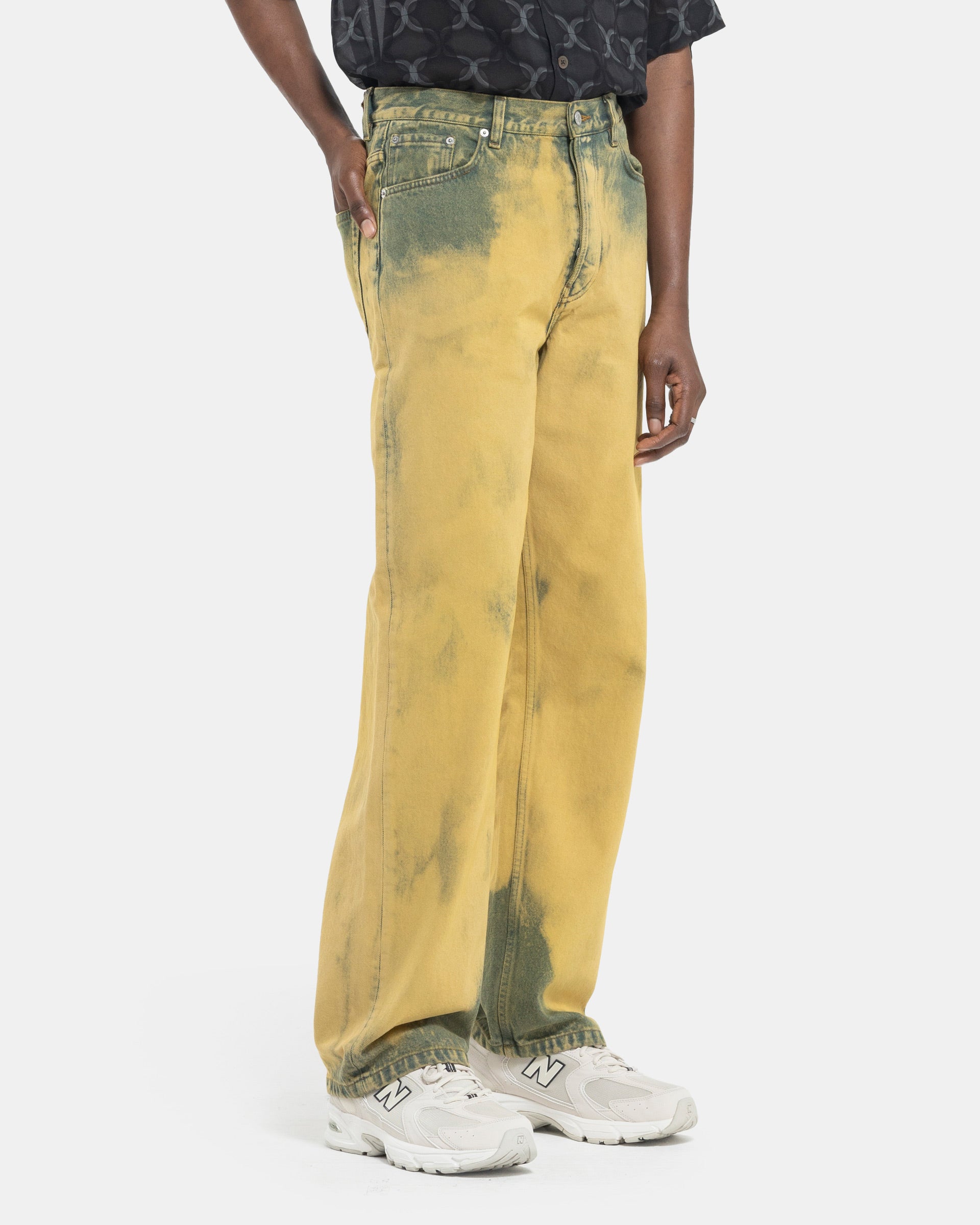 Model wearing Dries Van Noten Pine Pants in Lime on white background