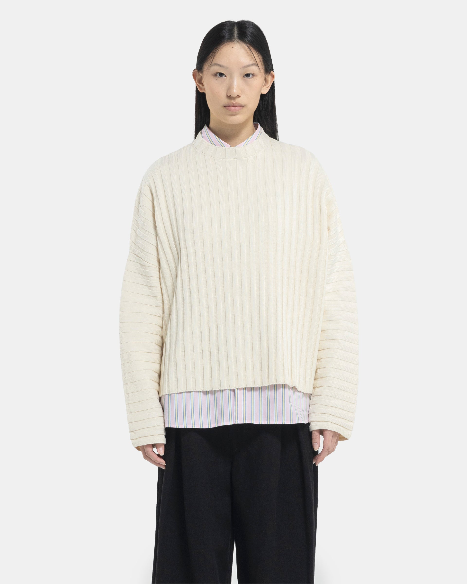 Female model wearing Eckhaus Latta Designer Wool Off-White Sweater with knit stripes