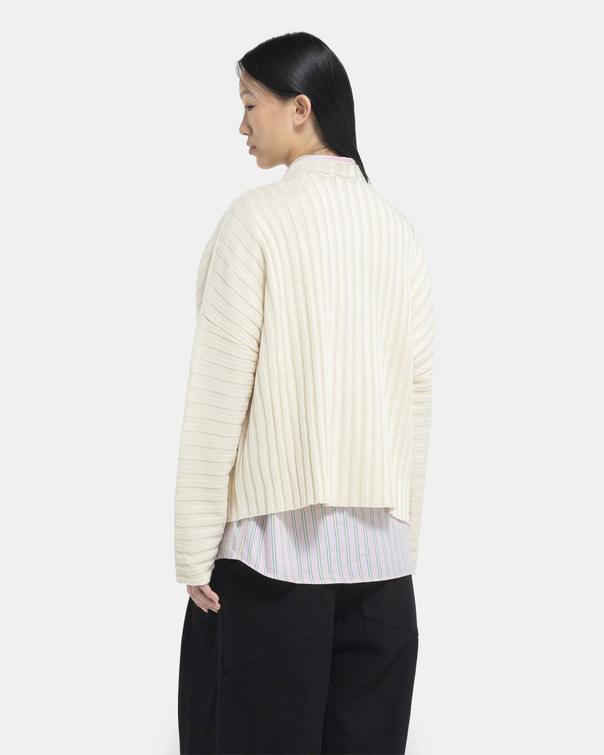 Female model wearing Eckhaus Latta Designer Wool Off-White Sweater with knit stripes