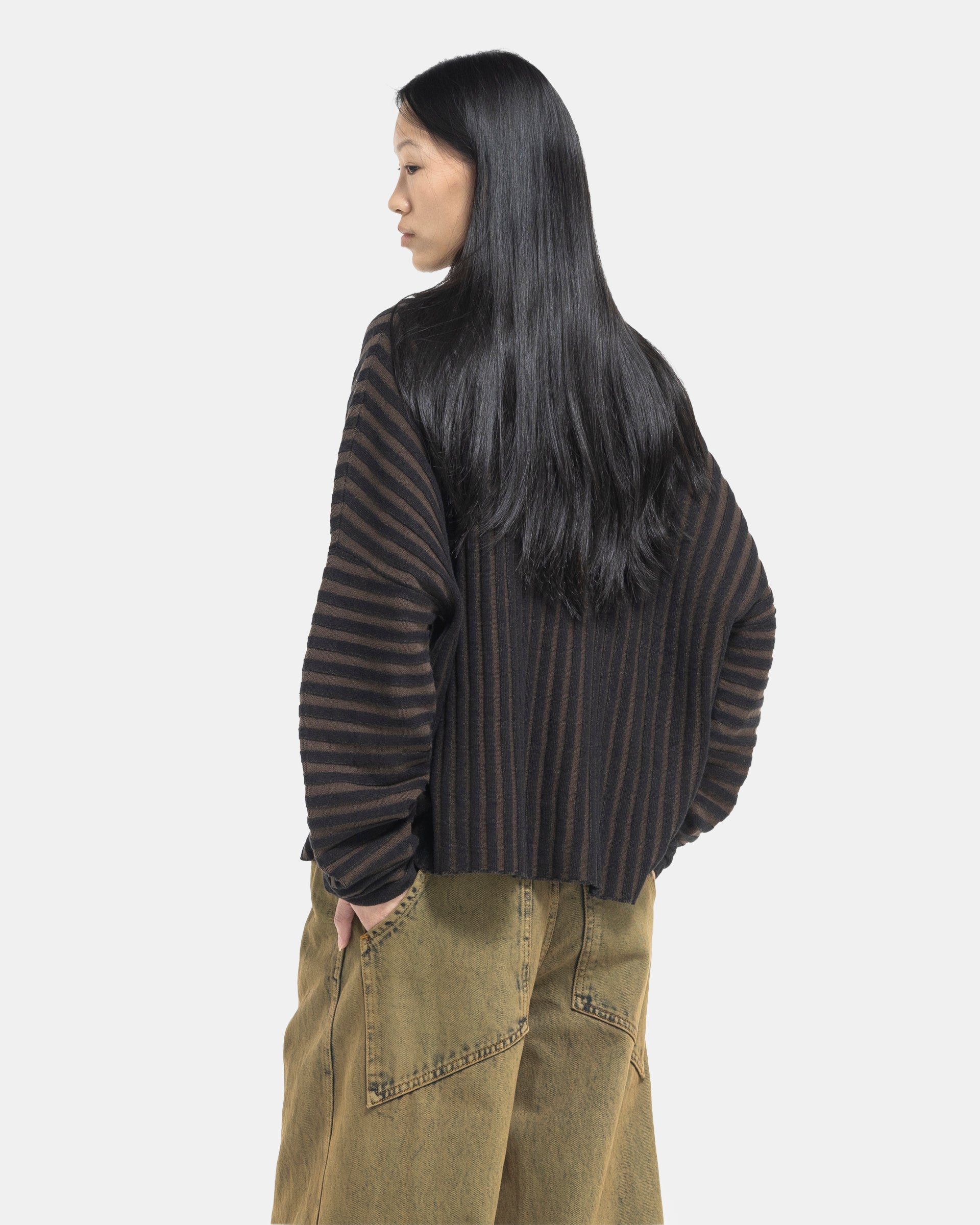 Female model wearing Eckhaus Latta Designer Wool Brown Sweater with knit stripes