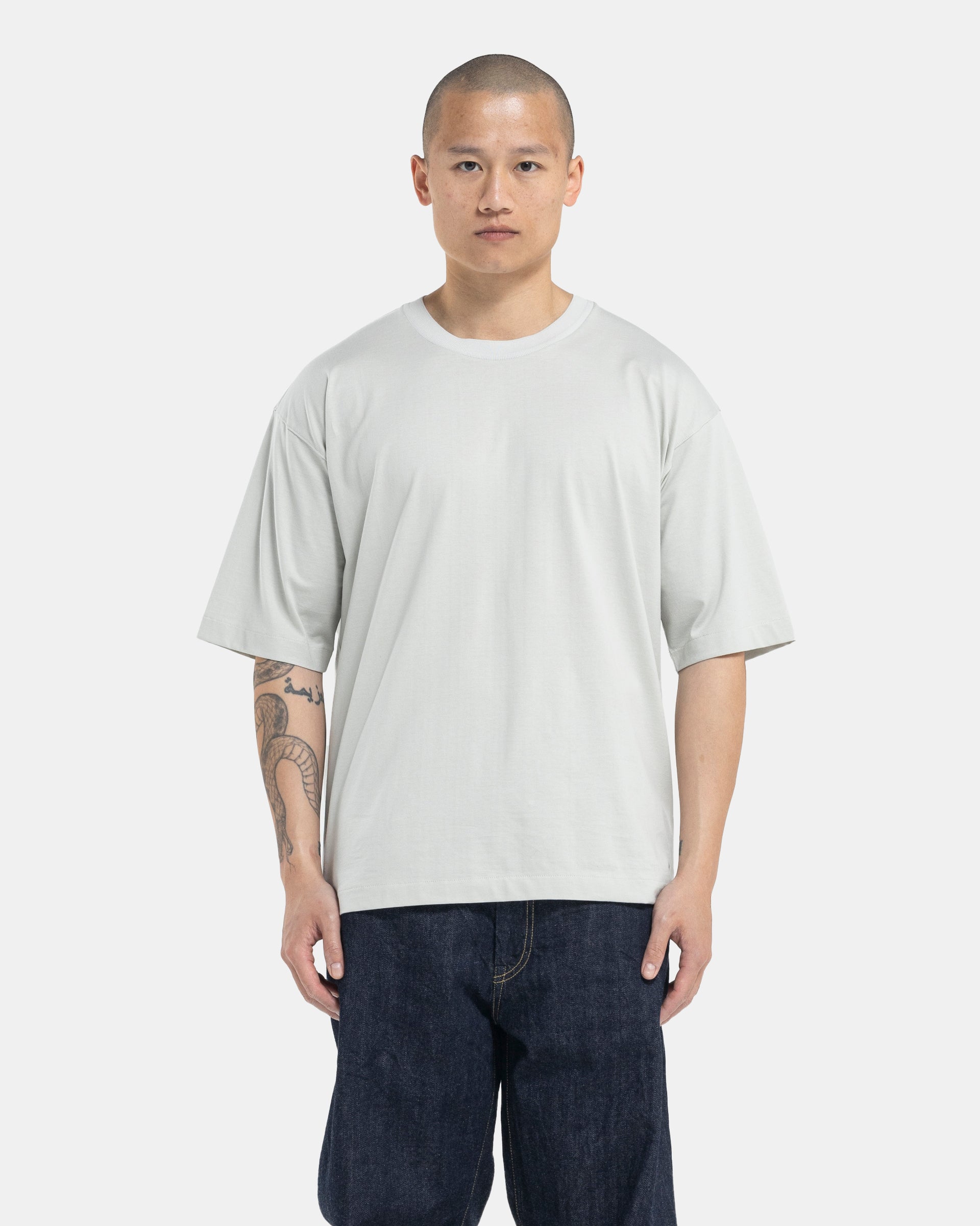 Male model wearing green Still By Hand T-shirt on white background