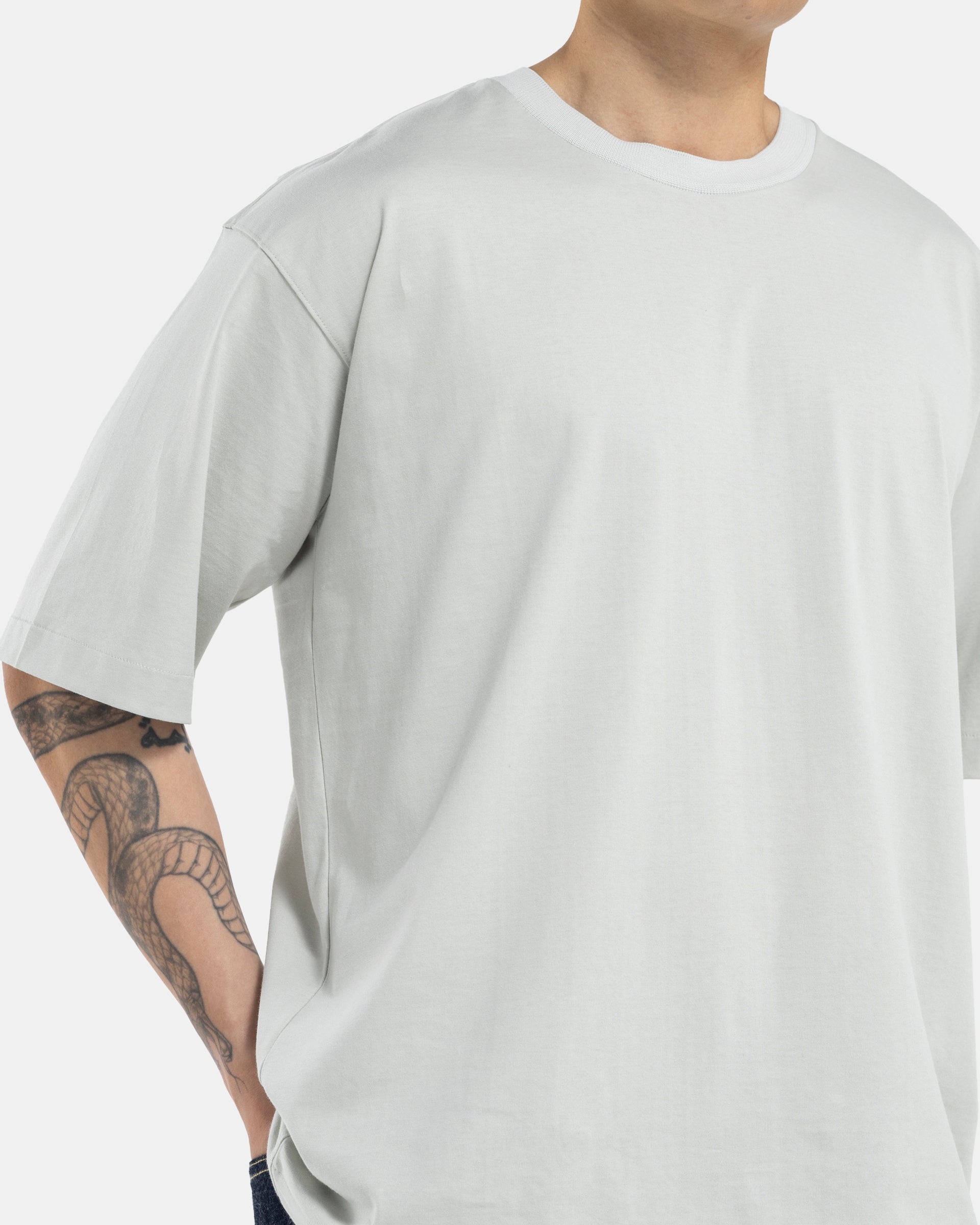 Male model wearing green Still By Hand T-shirt on white background
