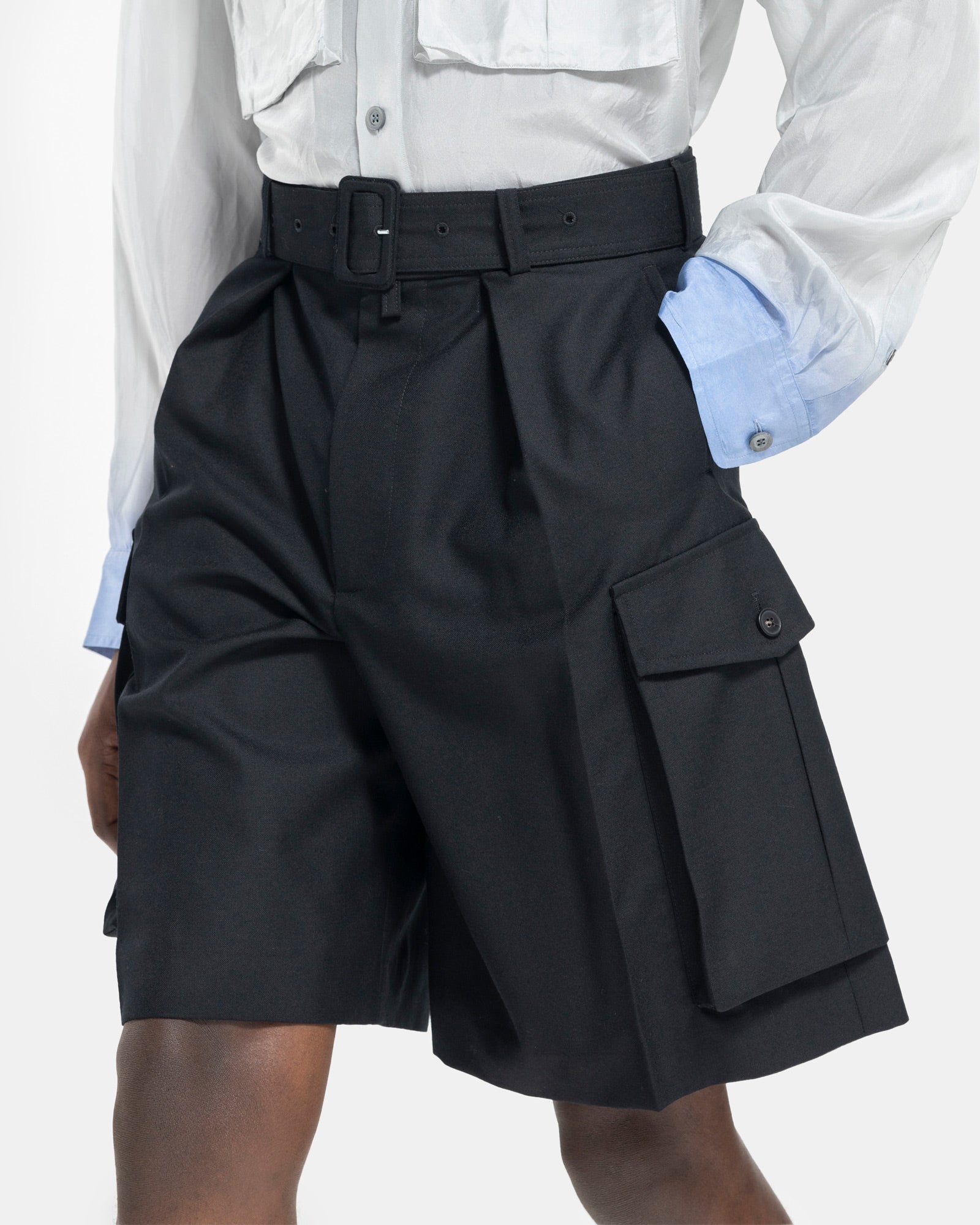 Close up Model wearing Dries Van Noten Piers Bis Shorts in Black on white background