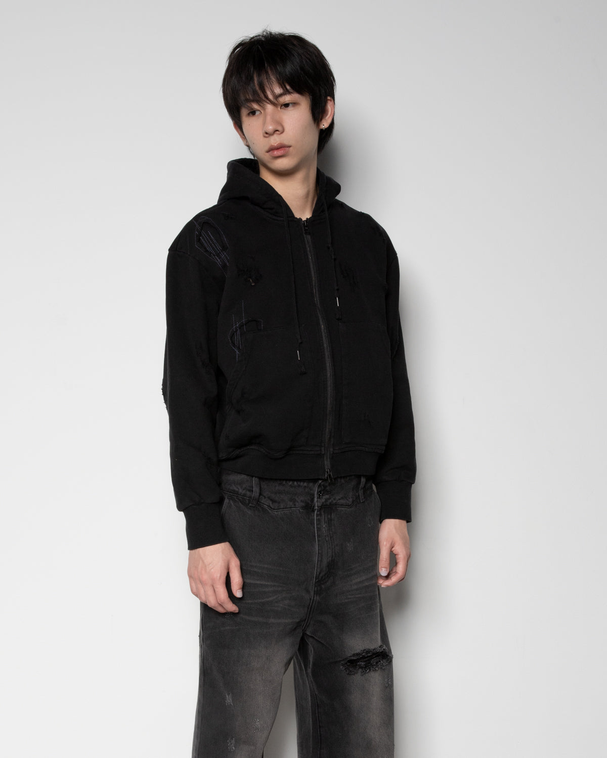 Distressed Zip-up Sweater in Black
