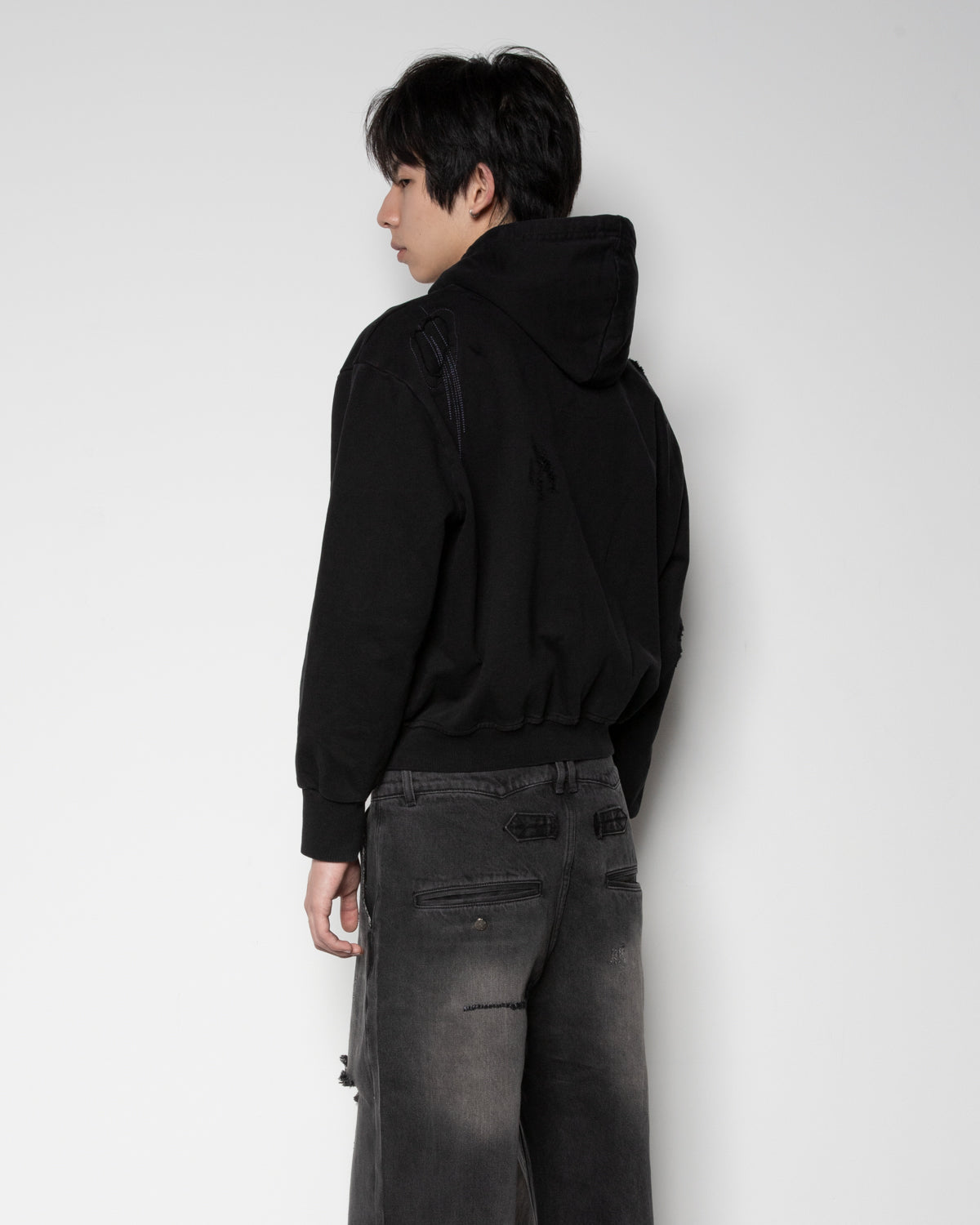 Distressed Zip-up Sweater in Black