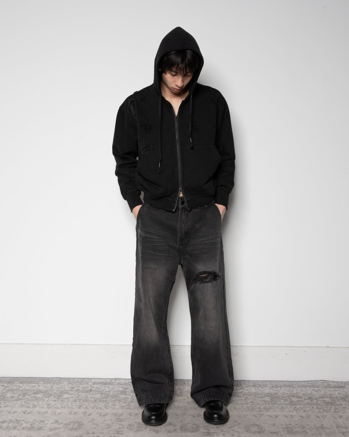 Distressed Zip-up Sweater in Black