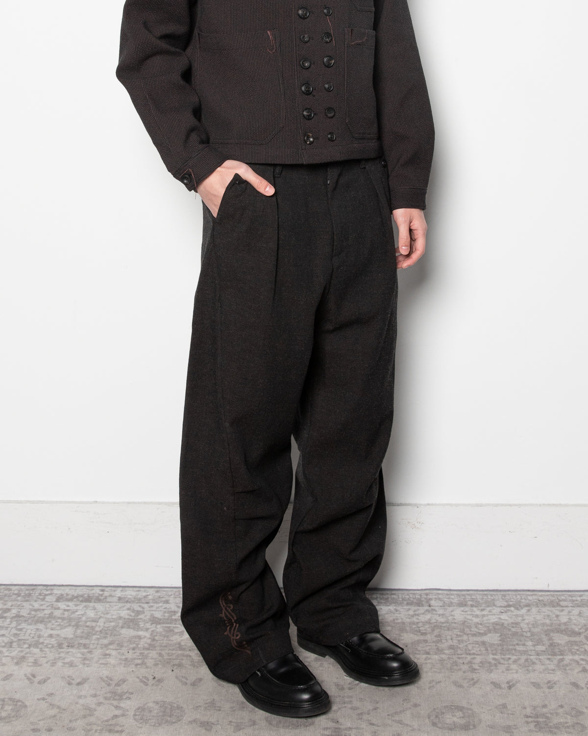 Embroidered Overlock Trousers in Black