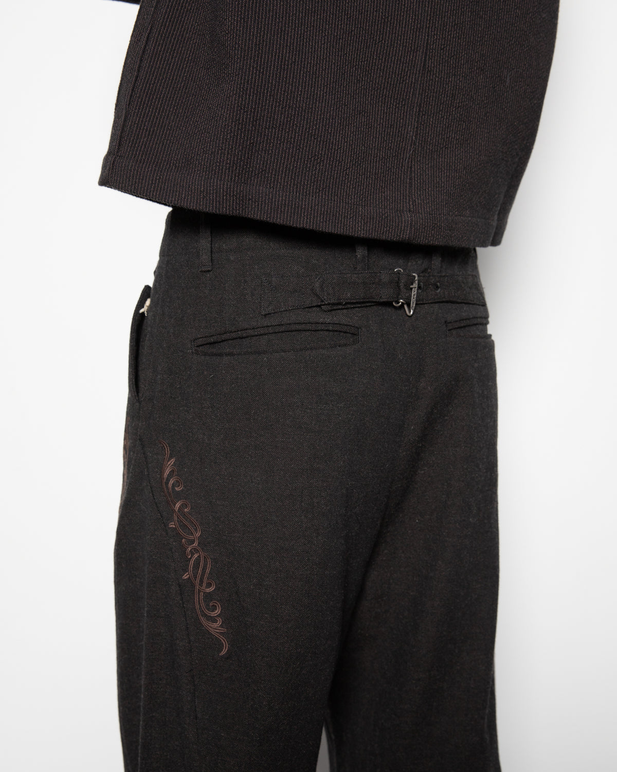 Embroidered Overlock Trousers in Black