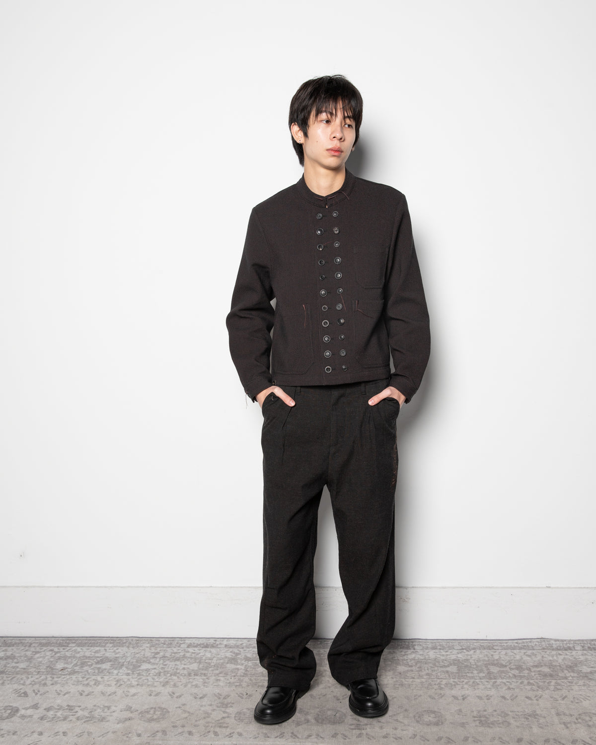 Embroidered Overlock Trousers in Black