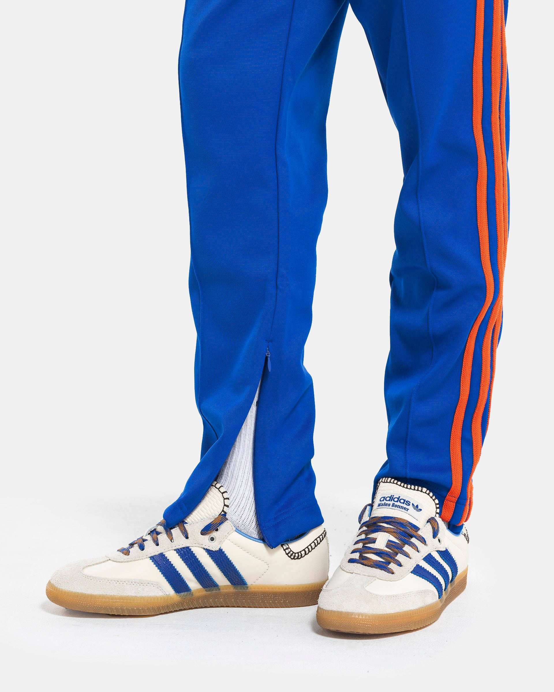 Model wearing Adidas Wales Bonner Jersey Stirrup Track Pant in Team Royal Blue on the white background