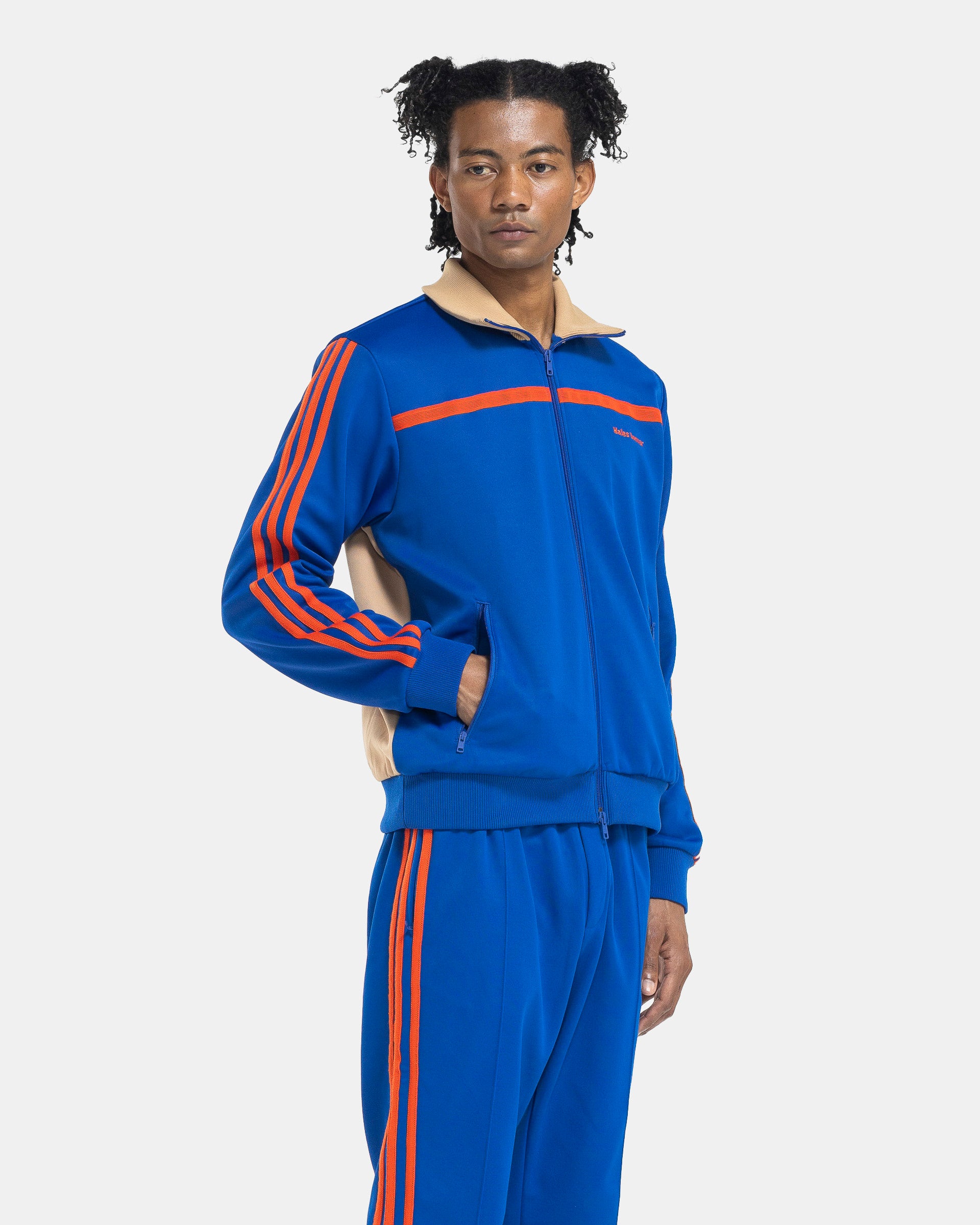 Model wearing Adidas Wales Bonner Jersey Track Topin Team Royal Blue on the white background