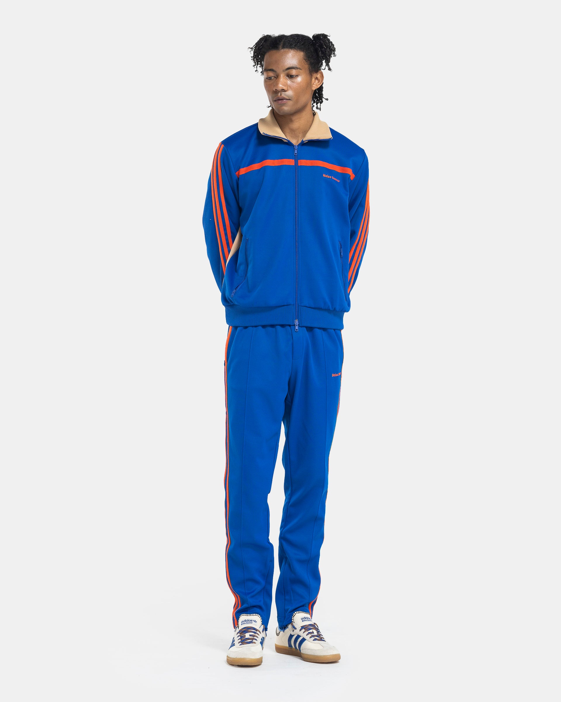 Model wearing Adidas Wales Bonner Jersey Stirrup Track Pant in Team Royal Blue on the white background