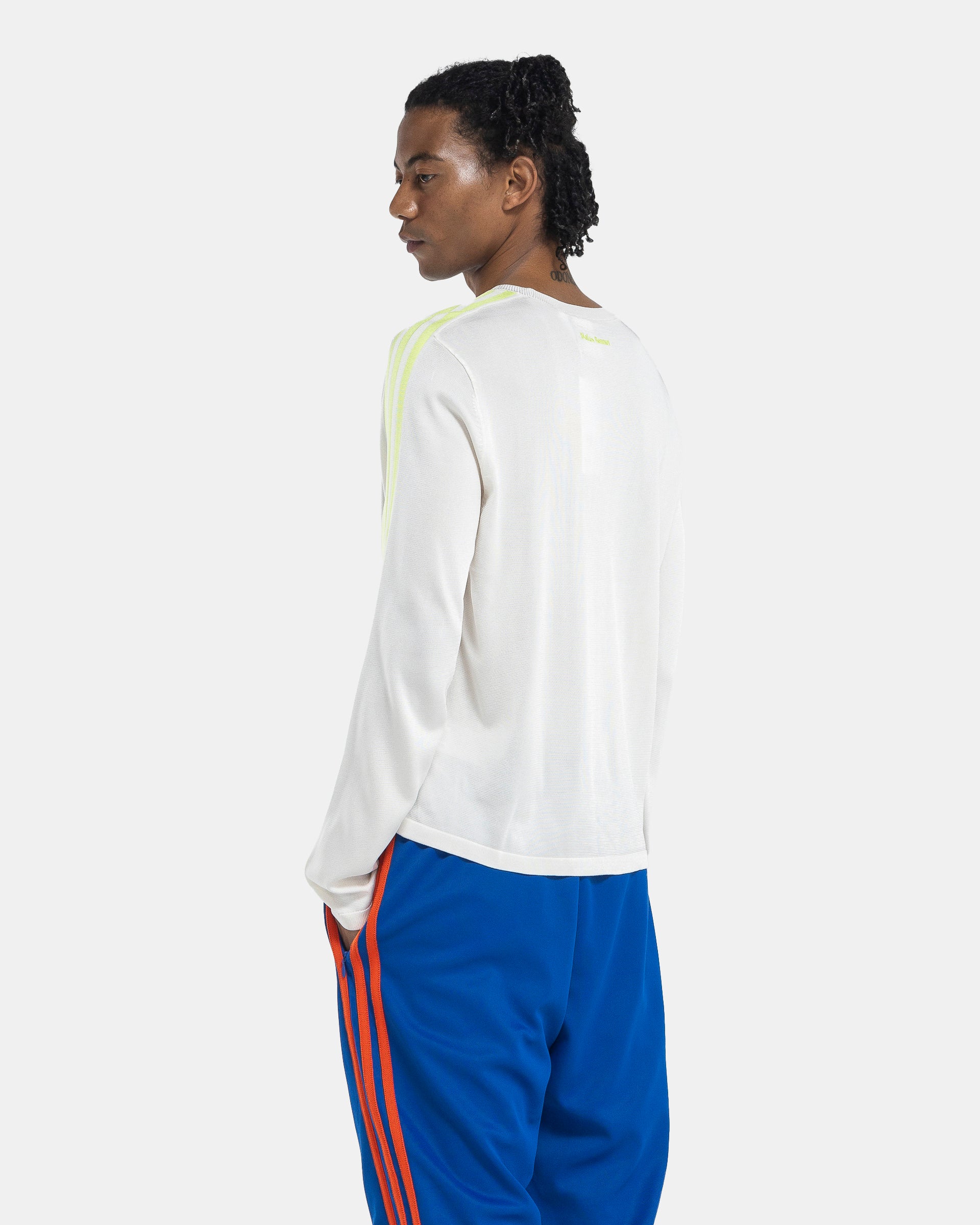 Model wearing Adidas Wales Bonner Knit LST-shirt in Chalk White on the white background