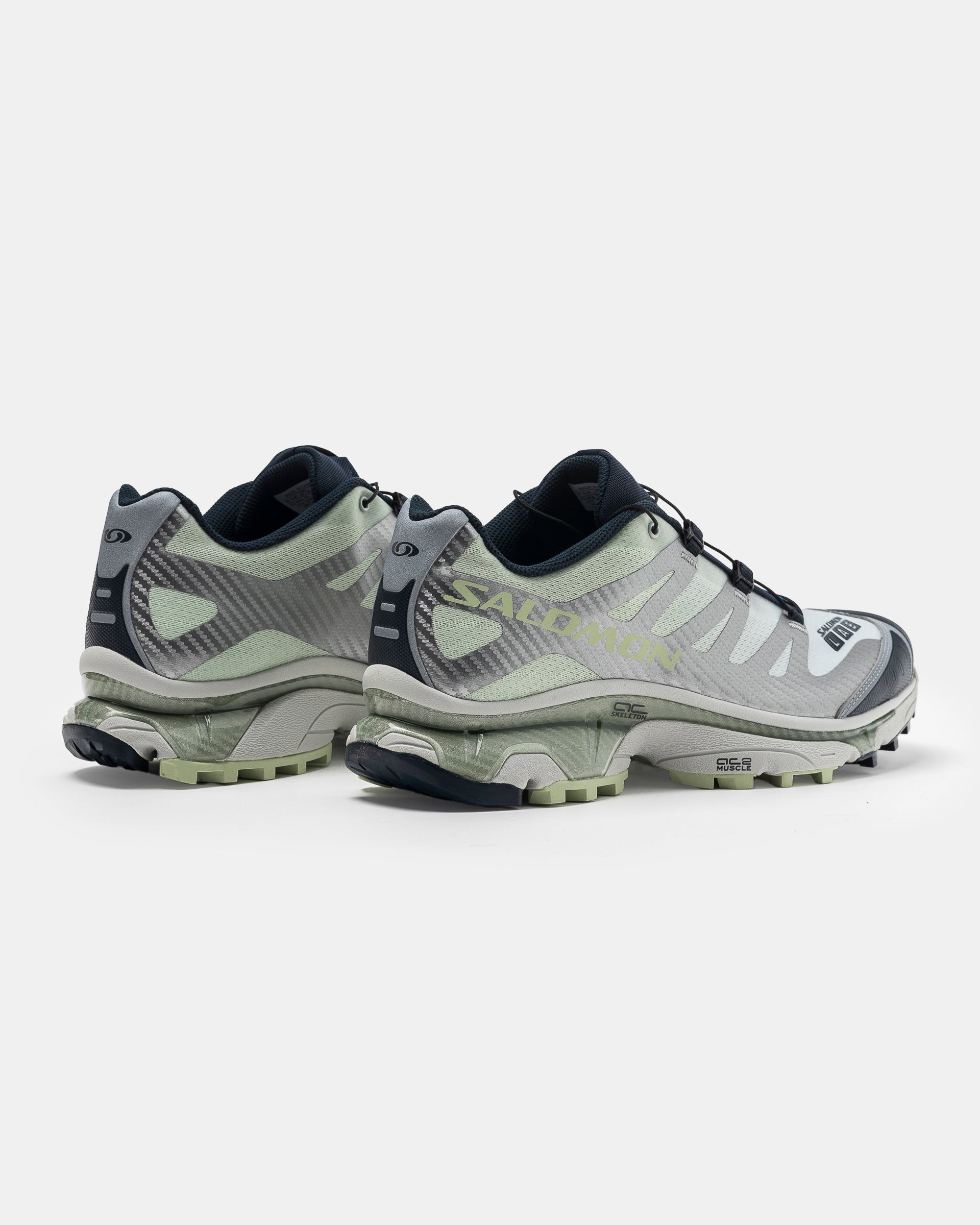 Salomon XT-4 OG in Carbon, Celadon Green, and Silver on the white background.