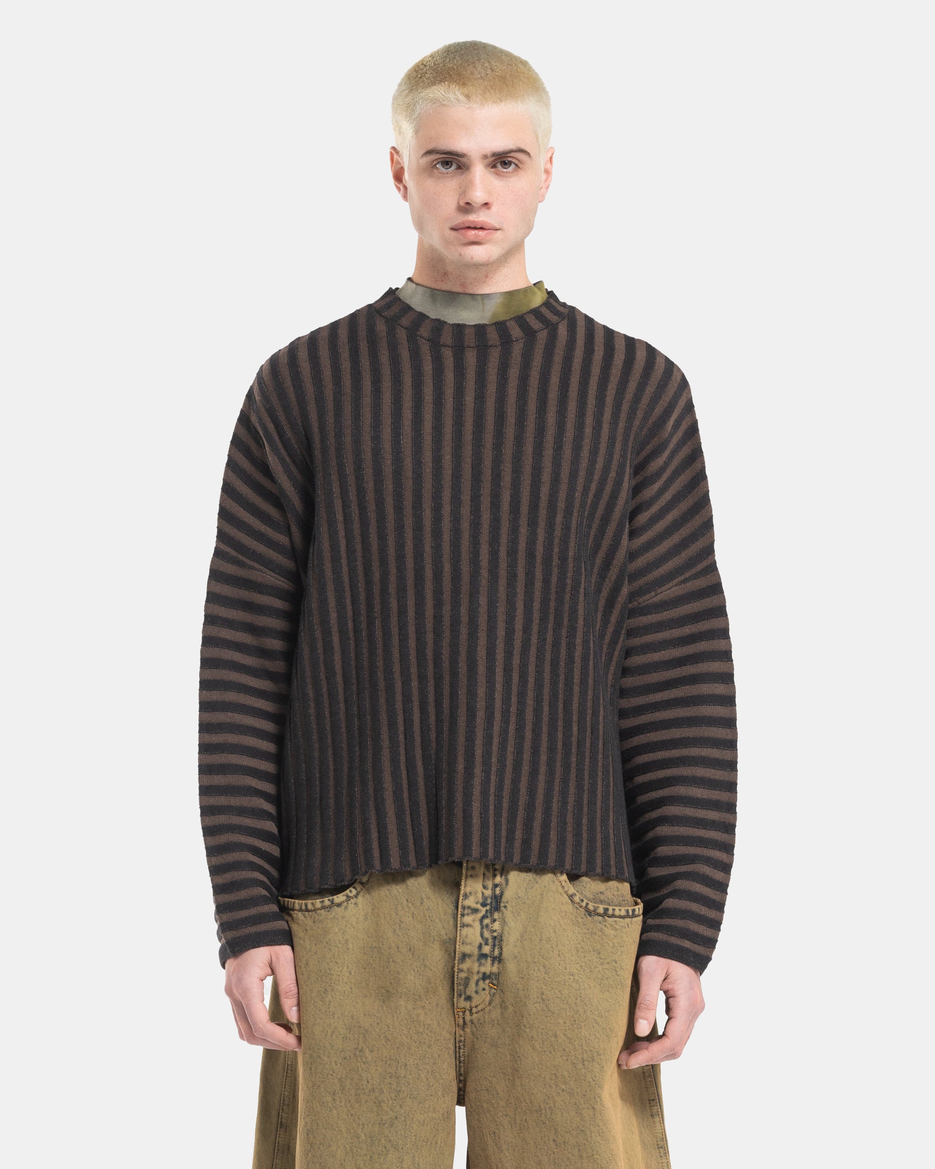 Male model wearing Eckhaus Latta Designer Wool Brown Sweater with knit stripes