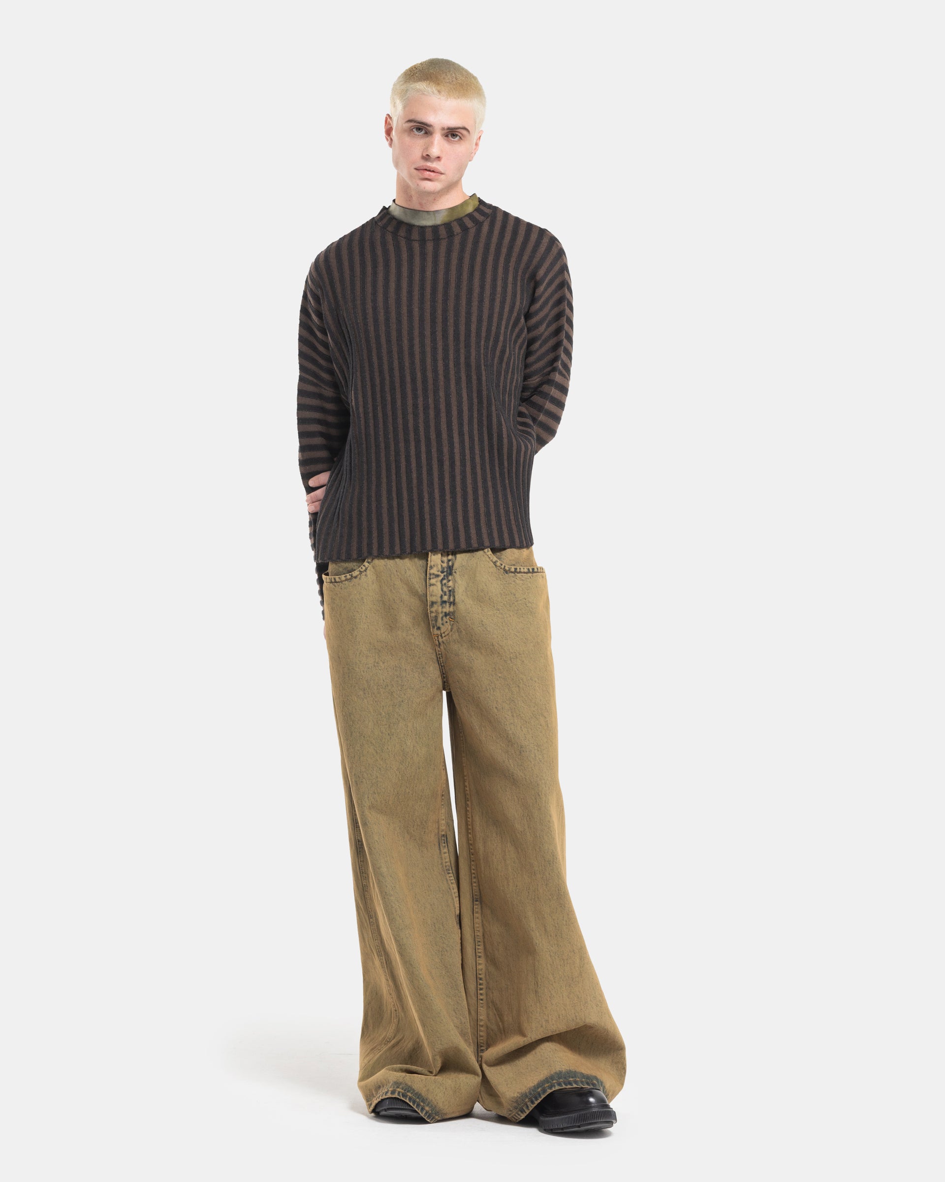 Male model wearing Eckhaus Latta Designer Wool Brown Sweater with knit stripes