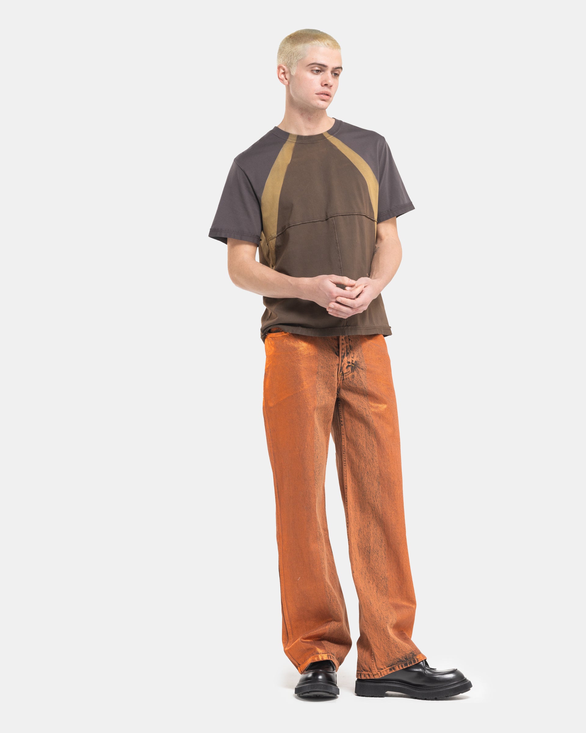 Male model wearing a brown Eckhaus Latta Lapped Tee