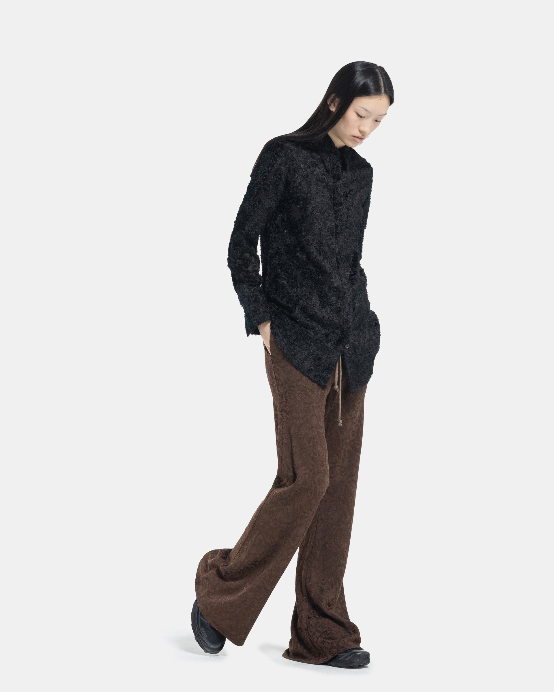 Model walking wearing Brown Bias Flared Pant and Long Shirt from Song For The Mute